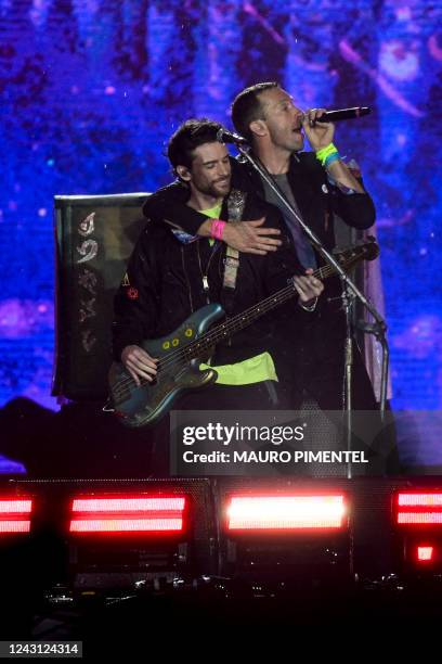 British singer Chris Martin and bassist Guy Berryman of British band Coldplay perform on the main stage during Rock in Rio music festival at Rio 2016...