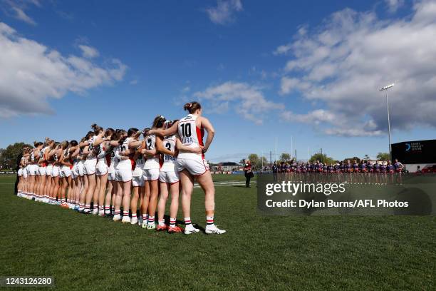 The players lineup for a welcome to country during the 2022 S7 AFLW Round 03 match between the St Kilda Saints and the Narrm Demons at RSEA Park on...