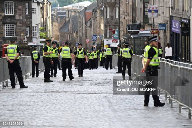 Police officers patrol in the streets of Edinburgh on September 11 as preparations are made for the arrival of the coffin of Queen Elizabeth II. -...