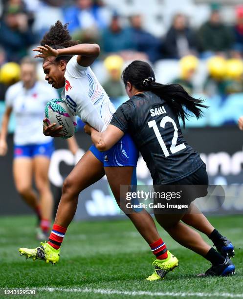 Yolaine Yengo of France tackled by Alena Saili of New Zealand during day 3 of the Rugby World Cup Sevens 2022 Match 23 Championship Semi Finals...