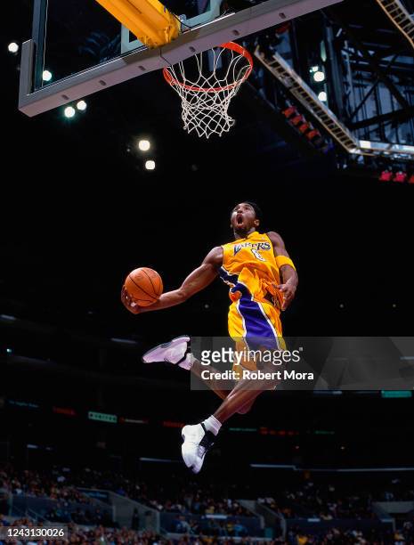Kobe Bryant of the Los Angeles Lakers goes up for a dunk against the Golden State Warriors at the Staples Center on March 4, 2001. NOTE TO USER: User...