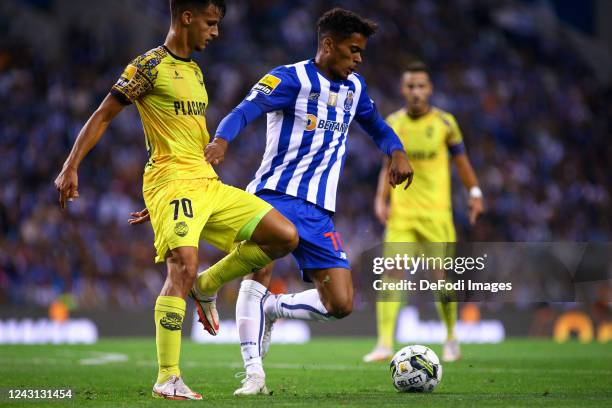 Goncalo Borges of FC Porto and Helder Morim of GD Chaves battle for the ball during the Liga Portugal Bwin match between FC Porto and GD Chaves at...
