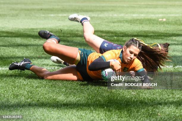 Charlotte Caslick of Australia scores a try during women's semi-final rugby match between Australia and USA at the Rugby World Cup Sevens tournament...