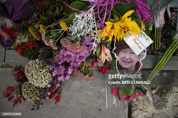 Floral tributes are seen outside Canterbury Cathedral, in south-east England on September 11 as people of the Diocese and throughout the Communion...