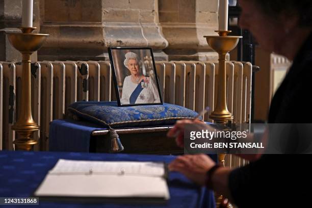 People sign books of condolence at Canterbury Cathedral, in south-east England on September 11 as people of the Diocese and throughout the Communion...