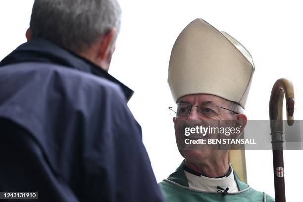Archbishop of Canterbury, Justin Welby speaks with worshippers as they leave after the Sunday Choral Eucharist at Canterbury Cathedral, in south-east...