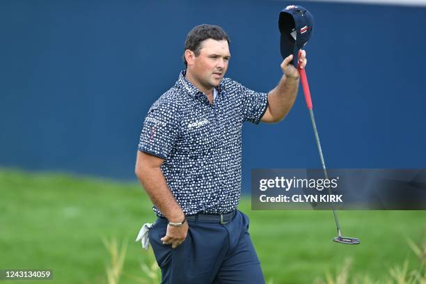 Golfer Patrick Reed reacts on the 18th green on the final day of the BMW PGA Championship at Wentworth Golf Club, south-west of London, on September...