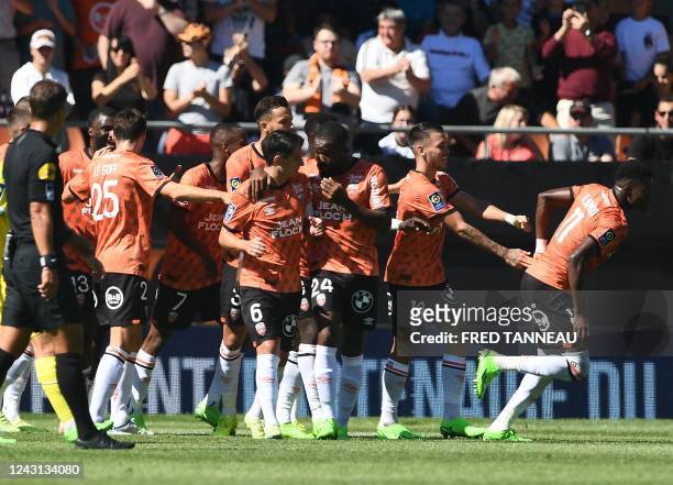 Lorient's Burkinabe forward Dango Ouattara celebrates with teammates after scoring the first goal for his team during the French L1 football match...