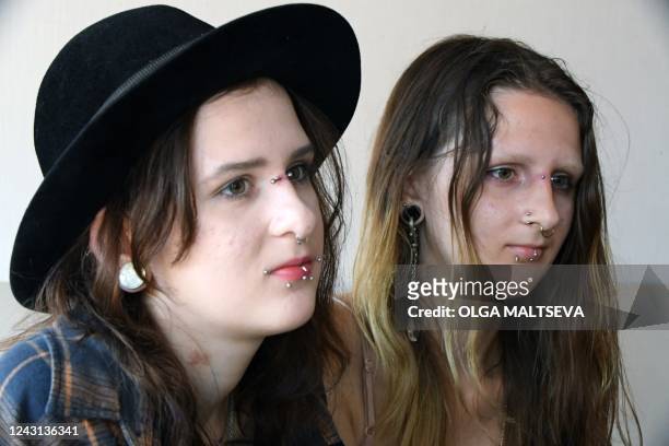 Year old twin sisters Elizaveta and Anastasia Grigorievy speak to a journalist during an interview in Pskov on August 19, 2022. - Their father is no...
