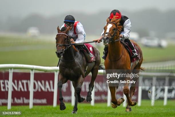 Kildare , Ireland - 11 September 2022; Kyprios, right, with Ryan Moore up, on their way to winning the Comer Group International Irish St Leger, from...