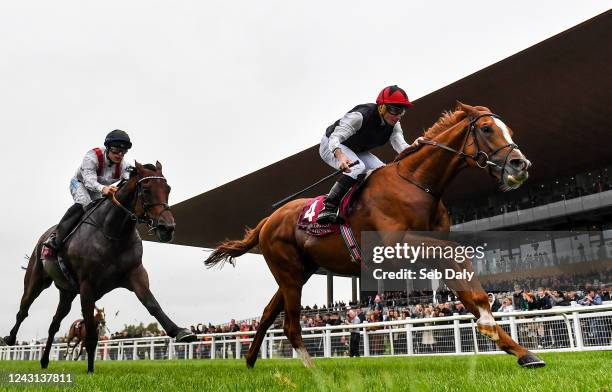 Kildare , Ireland - 11 September 2022; Kyprios, right, with Ryan Moore up, on their way to winning the Comer Group International Irish St Leger, from...