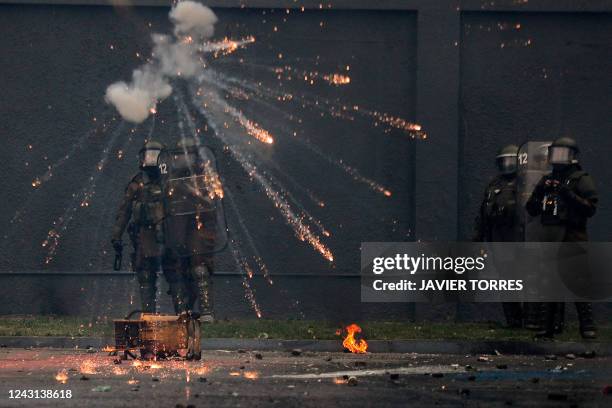 Riot police confront demonstrators during the commemoration of the 49th anniversary of the 1973 military coup d'etat of Augusto Pinochet and...