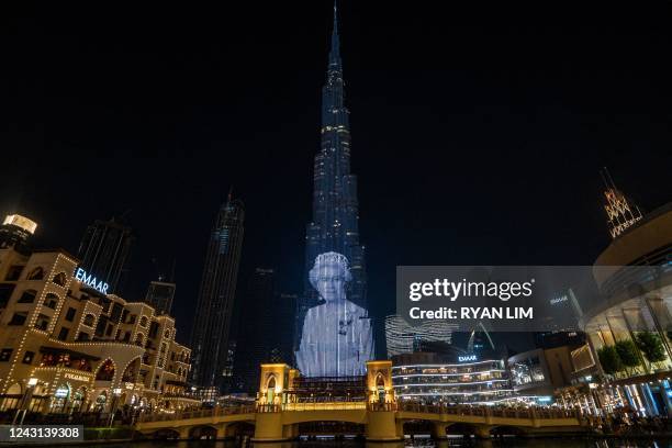 Portrait of Queen Elizabeth II of the United Kingdom is projected upon the Burj Khalifa, the world's tallest building, in the Gulf emirate of Dubai...