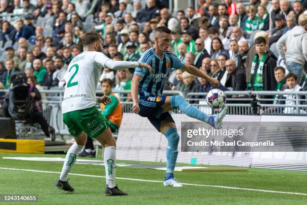 Haris Radetinac of Djurgarden against Simon Sandberg of Hammarby during an Allsvenskan match between Hammarby IF and Djurgardens IF at Tele2 Arena on...