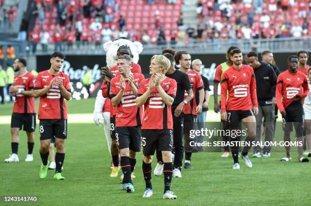 Rennes players celebrate their victory at the end of the French L1 football match between Stade Rennais FC and AJ Auxerre at The Roazhon Park Stadium...