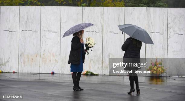 Visitors stand in front of the Wall of Names at the Flight 93 National Memorial during a ceremony commemorating the 21st anniversary of the crash of...