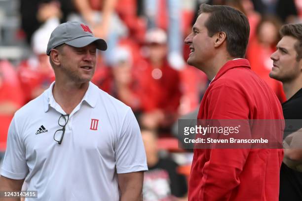 Head coach Scott Frost of the Nebraska Cornhuskers and Athletic Director Trev Alberts meet on the field before the game against the Georgia Southern...