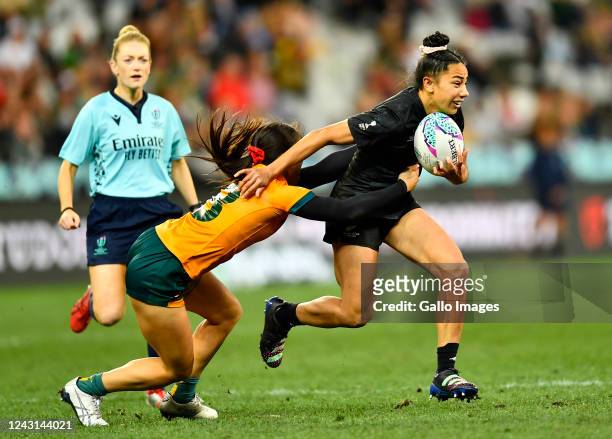 Risi Pouri-Lane of New Zealand tackled by Madison Ashby of Australia during day 3 of the Rugby World Cup Sevens 2022 Match 32 Championship Final...