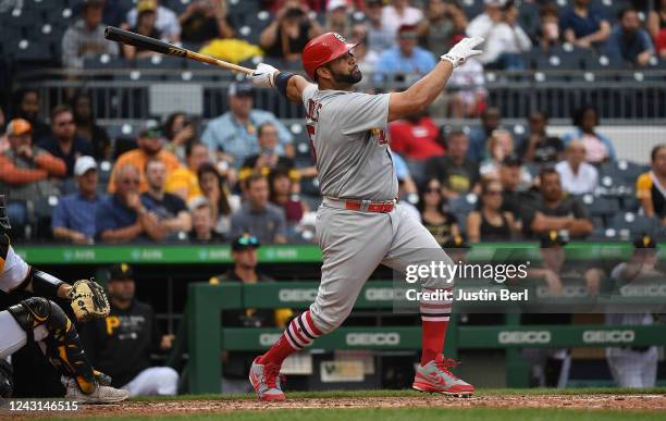 Albert Pujols of the St. Louis Cardinals hits a two-run home run in the ninth inning during the game against the Pittsburgh Pirates at PNC Park on...