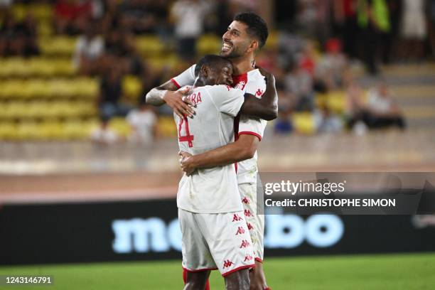 Monaco's Malian midfielder Mohamed Camara celebrates with Monaco's Chilean defender Guillermo Maripan during the French L1 football match between AS...