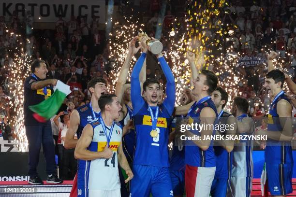 Italy's players celebrate with the trophy after winning the Men's Volleyball World Championship final match between Poland and Italy in Katowice,...