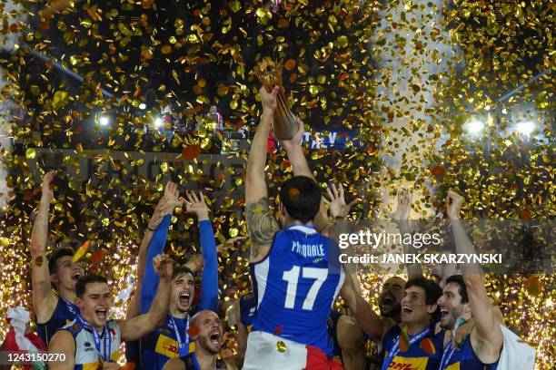 Italys Simone Anzani and his teammates celebrate with the trophy after winning the Men's Volleyball World Championship final match between Poland and...