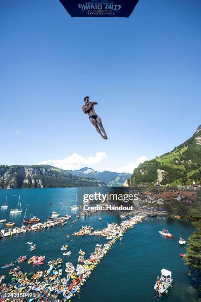 In this handout image provided by Red Bull, Aidan Heslop of the UK dives from the 27 metre platform during the final competition day of the sixth...