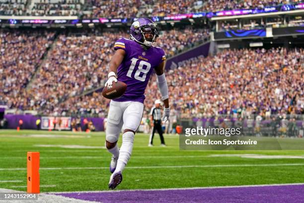 Minnesota Vikings wide receiver Justin Jefferson crosses the goal line for a touchdown after catching a 5-yard pass from Minnesota Vikings...
