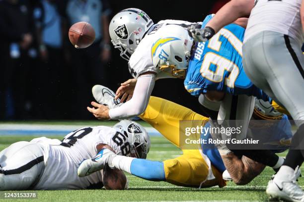 Inglewood, CA, Sunday, September 11, 2022 - Las Vegas Raiders quarterback Derek Carr fumbles the ball as he is sacked by Los Angeles Chargers...