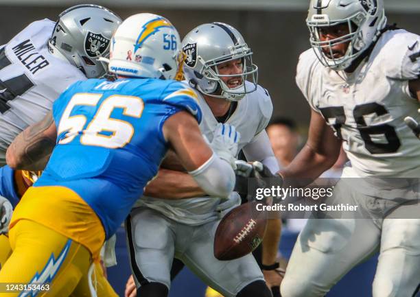 Inglewood, CA, Sunday, September 11, 2022 - Las Vegas Raiders quarterback Derek Carr fumbles the ball as he is sacked by Los Angeles Chargers...