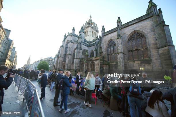People gather outside St Giles' Cathedral, in Edinburgh, ahead of the Procession of Queen Elizabeth's coffin from the Palace of Holyroodhouse to the...