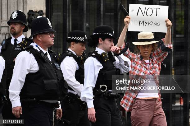 An anti-Royal demonstrator protests outside Palace of Westminster, central London on September 12 following the death of Queen Elizabeth II on...