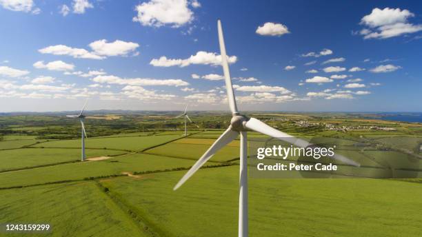 wind turbines in countryside - wind power uk stock pictures, royalty-free photos & images