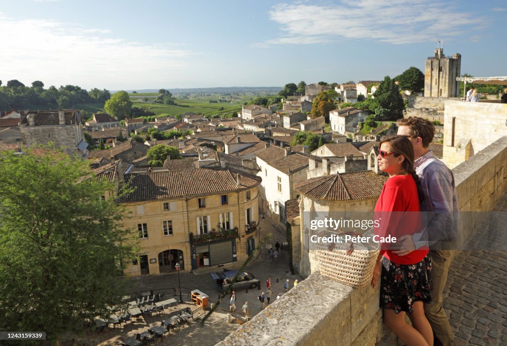 Couple admiring view of historic town