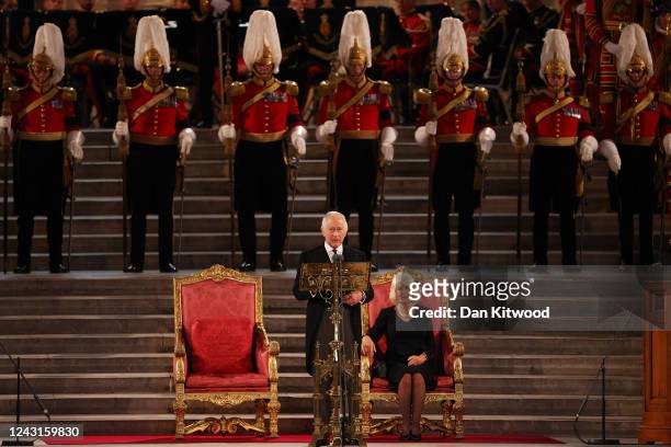 King Charles III takes part in an address as Camilla, Queen Consort looks on in Westminster Hall on September 12, 2022 in London, England. The Lord...