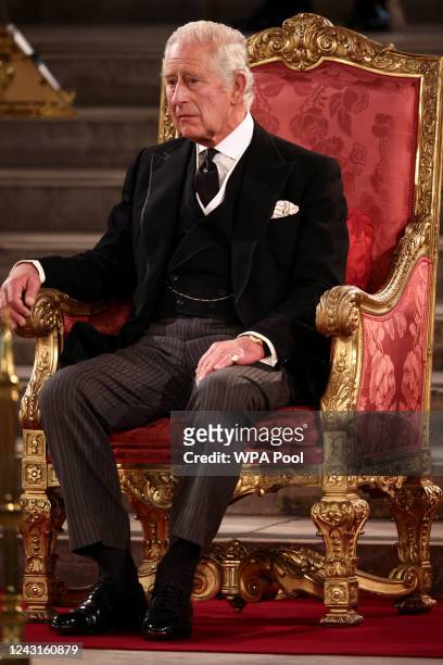 King Charles III looks on in Westminster Hall at Houses of Parliament on September 12, 2022 in London, England. The Lord Speaker and the Speaker of...