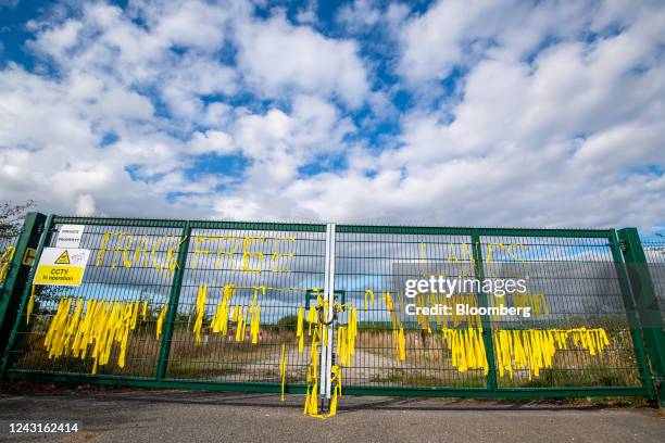 Yellow ribbons tied to read "Frack Free Lancs" on security gates at the Cuadrilla Resources Ltd. Exploration gas well site on Preston New Road near...