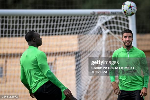 Sporting Lisbon's Portuguese midfielder Dario Essugo and Sporting Lisbon's Portuguese defender Goncalo Inacio take part in a training session at the...