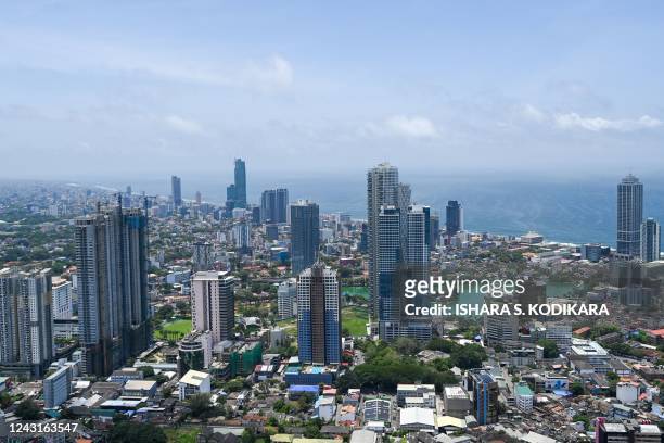 This picture taken on September 12 shows the city skyline as pictured from the observation deck of the Chinese-built Lotus Tower in Colombo. - A huge...