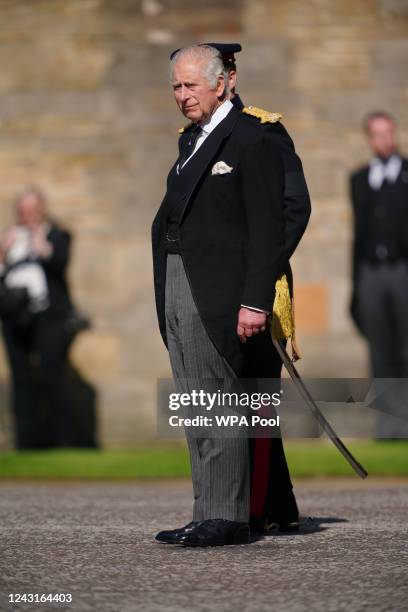 King Charles III inspects the Guard of Honour as he arrives for the Ceremony of the Keys at the Palace of Holyroodhouse, on September 12 in...