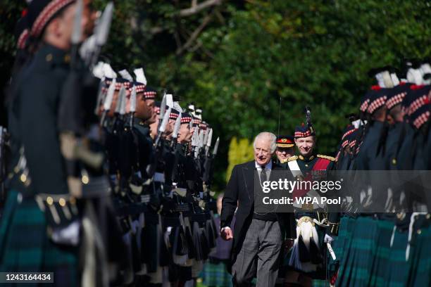 King Charles III inspects the Guard of Honour as he arrives for the Ceremony of the Keys at the Palace of Holyroodhouse, on September 12 in...