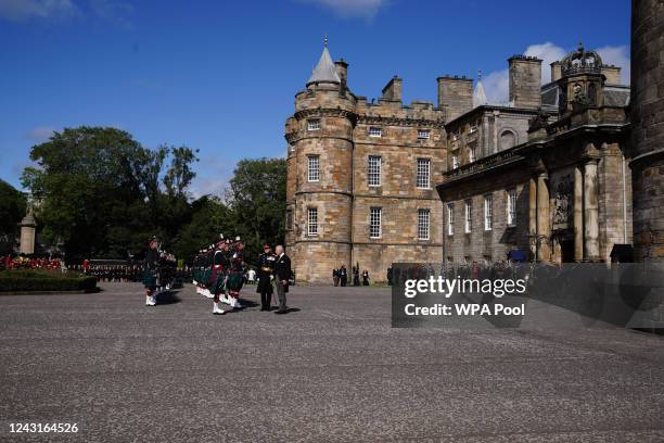 King Charles III inspects the Guard of Honour as he arrives for the Ceremony of the Keys at the Palace of Holyroodhouse, on September 12 in...