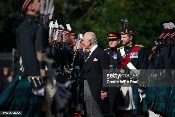 King Charles III inspects the Guard of Honour as he arrives for the Ceremony of the Keys at the Palace of Holyroodhouse, on September 12 in...