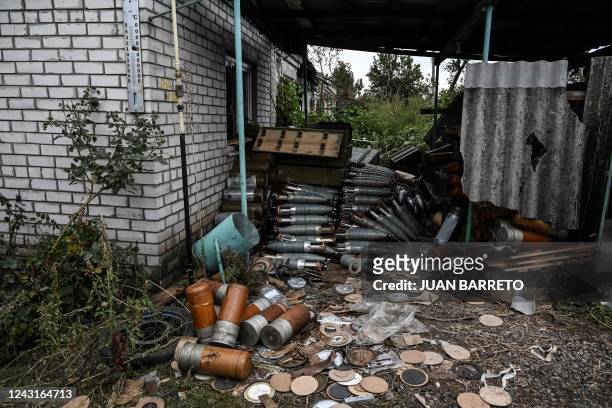 This photograph taken on September 11 shows abandoned munitions in a village on the outskirts of Izyum, Kharkiv Region, eastern Ukraine, amid the...