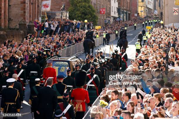 Britain's Prince Andrew, Duke of York, Britain's Princess Anne, Princess Royal and Britain's King Charles III walk behind the procession of Queen...