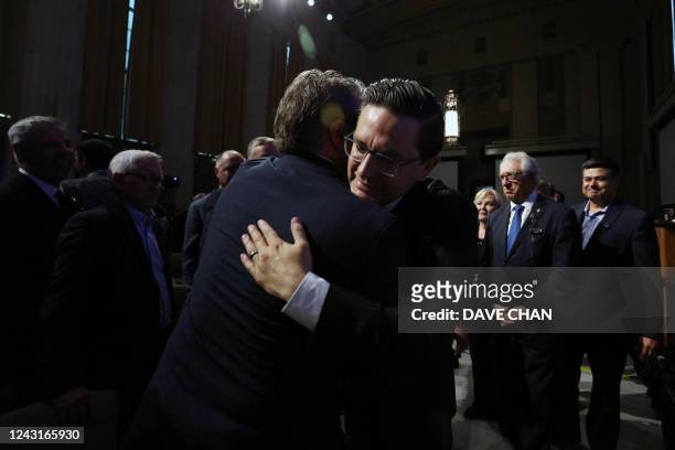 Canadian Conservative Party leader Pierre Poilievre greets party members at the start of the National Conservative caucus meeting in Ottawa, Canada...