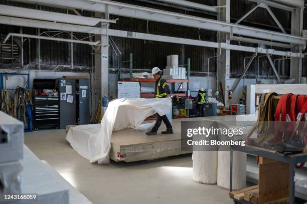 Worker wraps a Nexiite building panel for shipment to a construction site at the Nexii manufacturing and production facility in Squamish, British...
