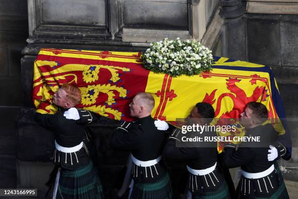 Pallbearers carry the coffin of Queen Elizabeth II into St Giles Cathedral in Edinburgh, on September 12 where Queen Elizabeth II will lie at rest....