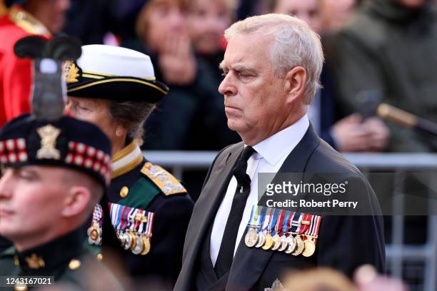 Princess Anne, Princess Royal and Prince Andrew, Duke of York walk behind Queen Elizabeth II's Coffin as it heads to St Giles Cathedral, after making...