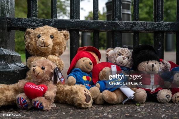 Paddington Bear soft toys are left outside Windsor Castle following the death of Queen Elizabeth II, on September 12, 2022 in London, United Kingdom....